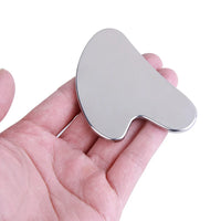 Gua Sha Acier Inoxydable KODOLUXE - tenu en main