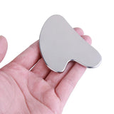 Gua Sha Acier Inoxydable KODOLUXE - tenu en main