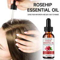 Application d'huile de rose musquée sur le cuir chevelu